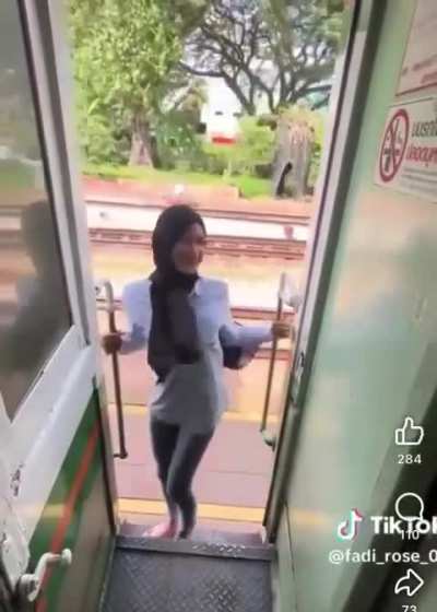 Hanging outside the train for selfie