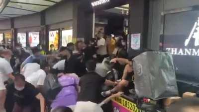 People in China trying to escape from a store before a compulsory lockdown after 1 case of COVID was detected