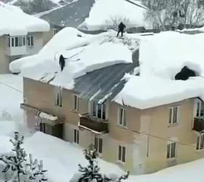 WCGW knocking snow off a roof