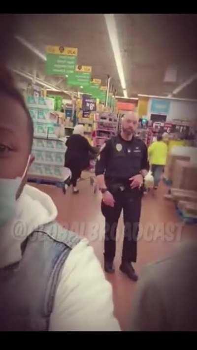 Racist officer tells two black men they actually can't wear their masks in Walmart