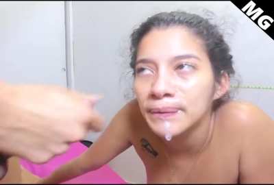 DIY webcam latina takes the facial... but clearly doesn't enjoy it!