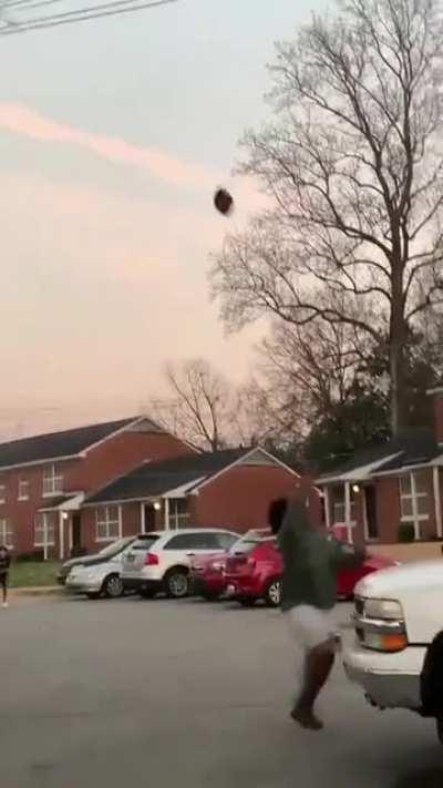 Catching a football.
