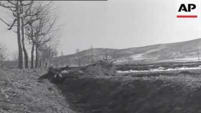 U.S. and South Korean combatants assaults a Communist-held village near Suwon, South Korea (1950)