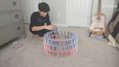Me building a 7 story circular card tower.