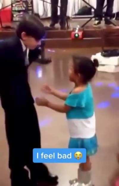 Girl pushes other girl away to dance with a 10 year old for some reason