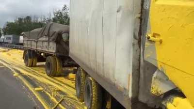 Guy crashes into a paint truck. Gets covered in paint.