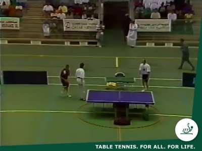 Just guys playing ping pong