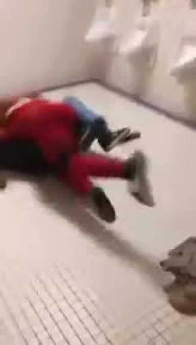 Knocked out in bathroom fight