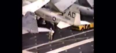 A helicopter from USS America dropping off heavily greased pigs on USS John F. Kennedy as a prank in the Mediterranean in 1986