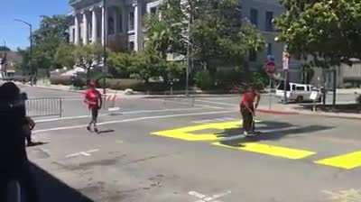White couple tries to cover Black Lives Matter on road with paint