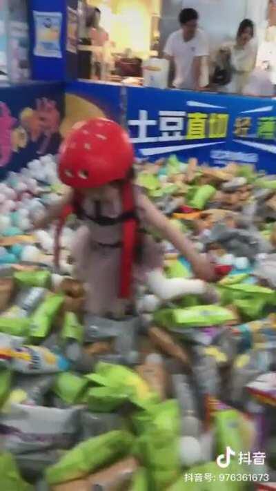 The object of this game is to be attached to a harness and grab as many chips as possible