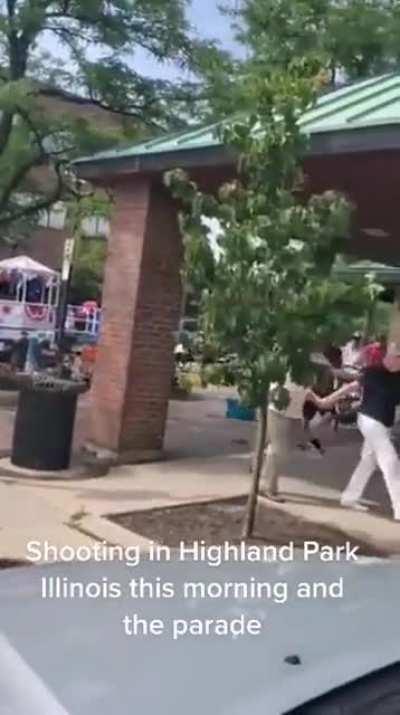 Video shows people fleeing parade at Highland Park as shots are fired