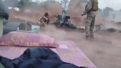 A Indian artillery battery of 130mm M-46's fires a volley at Pakistani army postions on the line of contact.