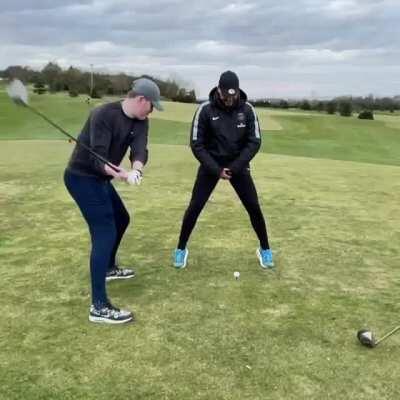 I will stand in front of the golf ball with my legs opened. Good idea, WCGW?