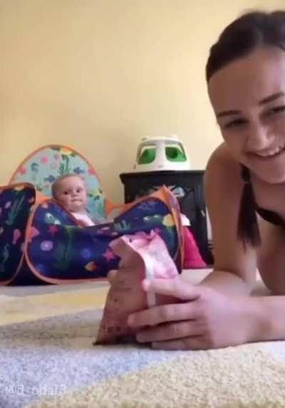 Baby knows that sound means snack time!