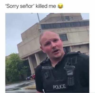 Guy talking a picture of a police station