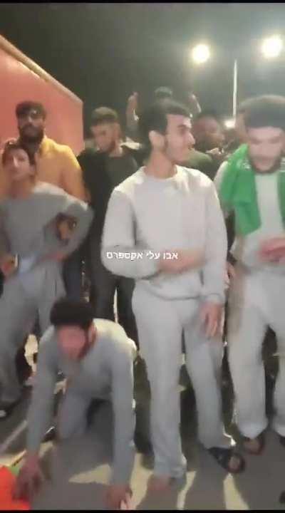 Released prisoners rejoicing with hamas headbands after being released in yesterday’s swap