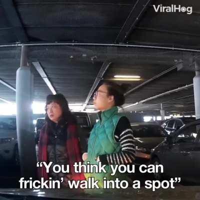 A woman ran into a parking space and stopped there to “reserve it”
