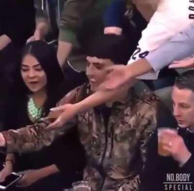 Girl steals wristband dude caught from Kobe. It&rsquo;s amazing how she shows no shame or really any emotion towards her actions whatsoever.