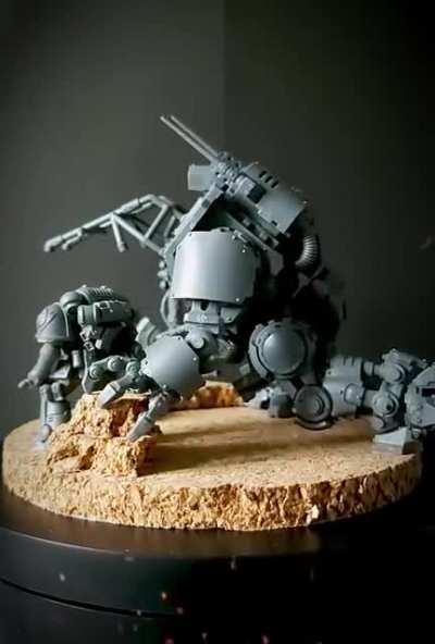 My most recent build, the invictor warsuit and its pilot, taking a break to make camp.