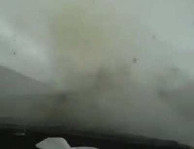 Tornado eats car in front.