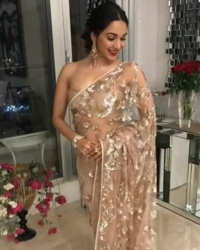 I wish the saree slipped down and revealed more of her smooth silky body