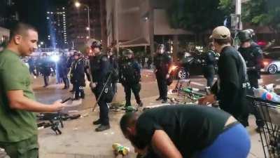 Lakers fan gets knocked after cop pushes him.