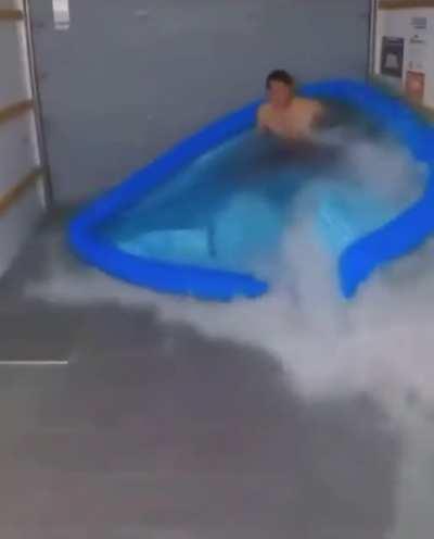 By putting enough water to drown in but not enough to cushion him