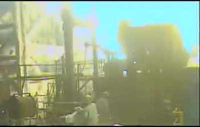 Throwing a water bottle into molten steel. (angle showing bottle throw by coworker in comments)