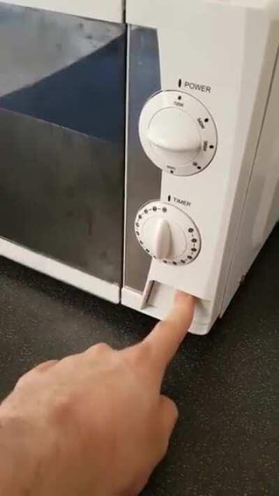 The button opens the door, so the door opens the button