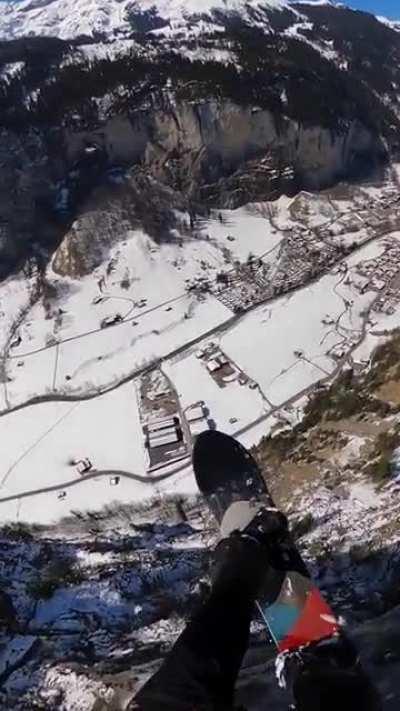 Snowboarding off a cliff