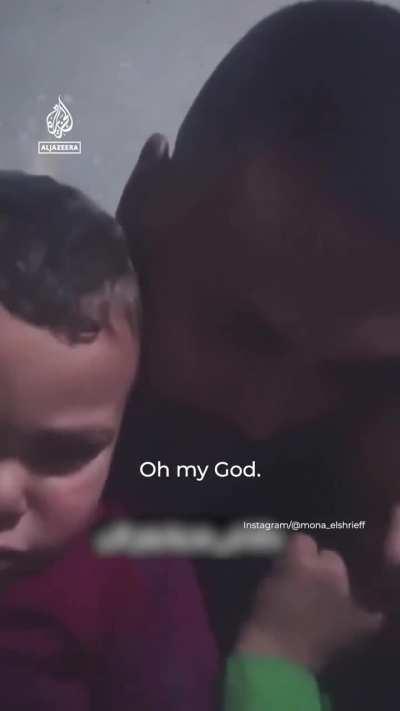 a Palestinian family, a father and his terrorized, traumatized and terrified little children sheltering in their home as the Zionist regime’s relentless bombardment in Rafah continues and as the near by shelling can be heard