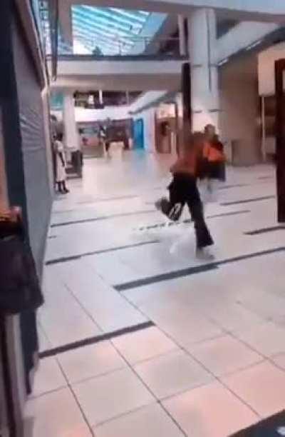 Footage of the gunman from today's shooting at Field's shopping centre in Copenhagen, Denmark chasing two people, armed with a rifle