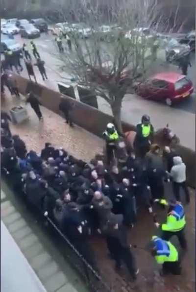 Everton fans (left) clash with Millwall fans (right) ahead of match in the FA cup 