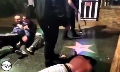 Drunk guy shoves woman and instantly regrets it