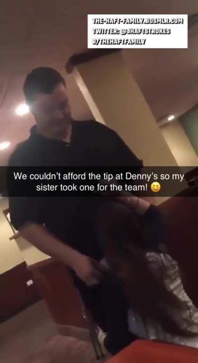 Sister tipping waiter at diner