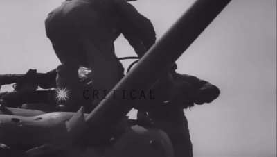 French tank crew removing body of dead soldier from tank (August 1944) 