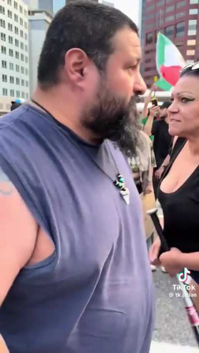 Guy with Punisher tattoo tells protestors to put up their dukes