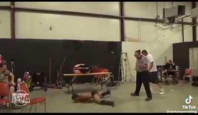Wrestler overshoots elbow drop from 20 Feet up onto concrete floor.