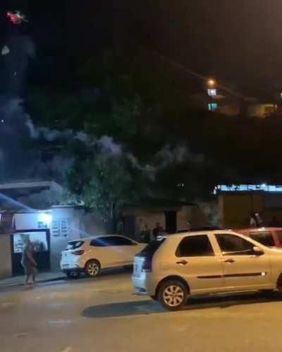 Man shoots fireworks from his drone towards a crowd of people that refused to turn down their music