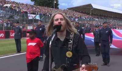 Kid forgot to take off his cap during the national anthem