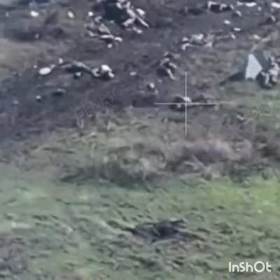 NSFW. Two russian soldiers lying in a breached defensive line receive a direct artillery hit. Novotoretske, October 2025 (geo-location included).