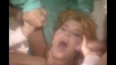 She tries to turn her head, but finds another cock waiting to cum