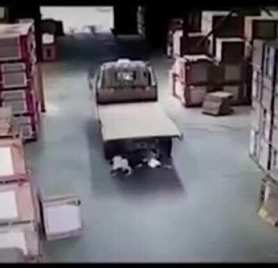 Riding a bicycle in a factory.