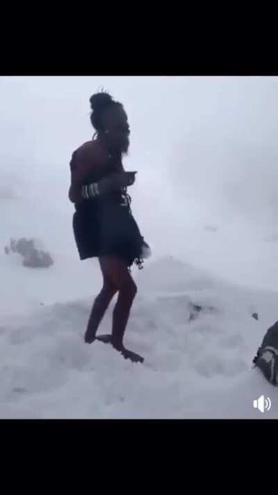 Sadhus in the Himalayas worship Lord Shiva in the snow.