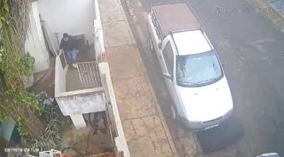 A car crashed into a fence and hit a woman climbing the stairs 