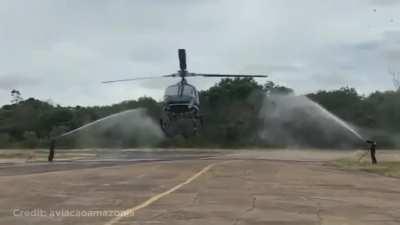 To water salute the helicopter