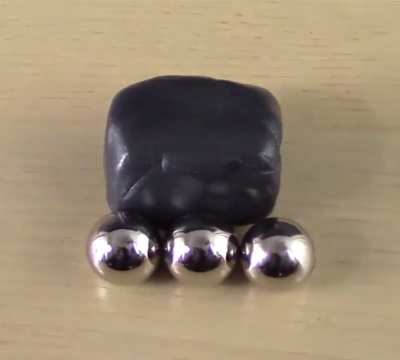How a blob of Ferromagnetic Putty reacts to a Neodymium magnet 