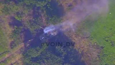 RU pov: Lancet drone hits a  BMP with Ukrainian soldiers on top of it. The hit sets a soldier on fire. Zaporyzhe region. 