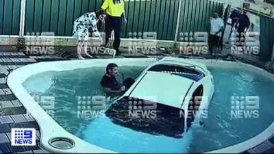 Driver ploughs through fence into swimming pool